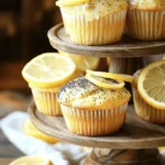 To create these delightful lemon poppy seed muffins, you will need the following ingredients: - 1 ½ cups all-purpose flour - ½ cup granulated sugar - 2 tablespoons poppy seeds - 1 tablespoon baking powder - ½ teaspoon salt - 1 large egg - ½ cup whole milk - ⅓ cup vegetable oil - Zest of 1 lemon - 2 tablespoons fresh lemon juice - 1 teaspoon vanilla extract - Optional Glaze: 1 cup powdered sugar + 2 tablespoons lemon juice These ingredients work together to create a soft, fluffy muffin packed with bright lemon flavor. The poppy seeds add a nice crunch and visual appeal. You can find the full recipe above to guide you through the process. Enjoy the fresh taste of lemon in every bite! Preheat the Oven Start by preheating your oven to 350°F (175°C). This is key for even baking. Line a 12-cup muffin tin with paper liners. This keeps the muffins from sticking. Combine Dry Ingredients In a large mixing bowl, whisk together the all-purpose flour, granulated sugar, poppy seeds, baking powder, and salt. Mix well to ensure everything blends nicely. This helps the muffins rise evenly. Mix Wet Ingredients In another bowl, crack the large egg and beat it lightly. Add the whole milk, vegetable oil, lemon zest, fresh lemon juice, and vanilla extract. Whisk together until smooth. This adds moisture and flavor to your muffins. Combine Wet and Dry Mixtures Pour the wet mixture into the dry ingredients. Use a spatula or wooden spoon to gently stir. Mix just until combined; some lumps are okay. Overmixing can make the muffins tough. Fill Muffin Cups Using a spoon or an ice cream scoop, fill each muffin cup about ⅔ full. This gives them space to rise. Make sure they are all even, so they bake well. Bake Place the muffin tin in your preheated oven. Bake for about 18-20 minutes. Check their doneness by inserting a toothpick into a muffin. It should come out clean or with a few moist crumbs. Cool the Muffins Once baked, let the muffins cool in the tin for about 5 minutes. Then, transfer them to a wire rack. This prevents sogginess and keeps them fluffy. Prepare Glaze (Optional) If you want a glaze, mix the powdered sugar and lemon juice in a small bowl until smooth. Drizzle it over the cooled muffins. This adds a sweet and tangy finish. For more details, check out the [Full Recipe]. When making lemon poppy seed muffins, the key is to mix gently. Overmixing can make the muffins tough. When you combine the wet and dry ingredients, stir just until you see no flour. It’s okay to leave some lumps in the batter. This keeps your muffins light and fluffy. Make sure your oven is set to 350°F (175°C) before baking. An oven thermometer can help if your oven runs hot or cold. A consistent temperature ensures your muffins rise properly and bake evenly. To check if your muffins are done, use a toothpick. Insert it into the center of a muffin. If it comes out clean or with a few moist crumbs, your muffins are ready. If there’s wet batter on the toothpick, they need more time. Presentation makes your muffins look even more tempting. Arrange them on a tiered cake stand or a pretty platter. Garnish with thin lemon slices and a sprinkle of extra poppy seeds for a fresh touch. This small detail can impress your family and friends. For the full recipe, check the detailed section above! {{image_4}} You can make your lemon poppy seed muffins even better with fun add-ins. Try adding chocolate chips for a sweet twist. Dried fruit like cranberries or blueberries can add a nice chew. Nuts, such as walnuts or almonds, give a crunchy texture. You can even mix in fresh herbs like basil or mint for a unique flavor. Each addition changes the taste and makes the muffins special. If you need a gluten-free option, swap the all-purpose flour with a gluten-free blend. Many blends work well in baking. Look for a blend that contains xanthan gum, as it helps bind the ingredients. Almond flour also works, but you may need to adjust the liquid. Using gluten-free flour keeps the muffins light and fluffy without gluten. To make these muffins a bit healthier, use whole wheat flour instead of all-purpose flour. This adds fiber and nutrients. You can also cut down on sugar by using honey or maple syrup. Replace half of the oil with unsweetened applesauce to reduce fat. These changes keep the muffins tasty while adding some health benefits. For a lighter option, you can even use non-fat yogurt instead of oil. To keep your lemon poppy seed muffins fresh, store them in an airtight container. You can use a plastic bag or a cake dome. Place parchment paper between layers to avoid sticking. Keep them at room temperature for the best taste and texture. Freezing muffins is simple and effective. First, let them cool completely. Then, wrap each muffin tightly in plastic wrap. Place the wrapped muffins in a freezer-safe bag or container. They will stay fresh for up to three months in the freezer. When ready to eat, just thaw them at room temperature. You can also warm them in the oven for a few minutes. Lemon poppy seed muffins last for about three days at room temperature. If stored in the fridge, they can last for a week. However, for the best flavor, enjoy them fresh. If you see any signs of mold or a change in texture, it's best to toss them. Yes, you can use almond milk in place of whole milk. It works well in this recipe. The muffins will still be moist and tasty. Just make sure to choose an unsweetened version for the best flavor. If you do not have poppy seeds, try using sesame seeds or chia seeds. Both will add a nice crunch. You can also skip them if you prefer plain lemon muffins. To make lemon glaze, mix 1 cup of powdered sugar with 2 tablespoons of lemon juice. Stir until smooth. Drizzle it over your cooled muffins for a sweet and tangy touch. Yes, these muffins freeze well. Let them cool completely before storing. Place them in an airtight container or freezer bag. They can last up to three months in the freezer. Overbaked muffins will have a dry texture and dark edges. They may also crack on the top. To avoid this, keep an eye on them while baking. A toothpick should come out clean or with a few crumbs for perfect muffins. - 1 ½ cups all-purpose flour - ½ cup granulated sugar - 2 tablespoons poppy seeds - 1 tablespoon baking powder - ½ teaspoon salt - 1 large egg - ½ cup whole milk - ⅓ cup vegetable oil - Zest of 1 lemon - 2 tablespoons fresh lemon juice - 1 teaspoon vanilla extract - Optional Glaze: 1 cup powdered sugar + 2 tablespoons lemon juice To make these tasty lemon poppy seed muffins, start by preheating your oven to 350°F (175°C). Line a muffin tin with paper liners. Then, mix the dry ingredients in one bowl. In another bowl, whisk your wet ingredients. Combine wet and dry ingredients gently. Fill the muffin cups about two-thirds full. Bake for 18-20 minutes. Check if they’re done with a toothpick. After cooling, feel free to drizzle on the optional glaze if you want extra sweetness! For more detailed steps and techniques, check the article above for the full recipe. This blog post shared a simple muffin recipe using lemon and poppy seeds. You learned about the key ingredients and how to mix them. The step-by-step instructions guide you from prep to baking. Helpful tips ensure your muffins turn out great every time. You can even try fun variations to fit your taste. Now, you’re ready to bake. Enjoy these muffins fresh or share them with friends. Happy baking with your new recipe!