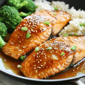 When making honey garlic glazed salmon, you need a few key items. Here’s the complete list of ingredients: - Salmon Fillets: 4 fillets, around 6 ounces each, are perfect for this dish. - Marinade Components: - 1/4 cup honey - 1/4 cup low-sodium soy sauce - 4 cloves garlic, finely minced - 1 teaspoon fresh ginger, finely grated - 1 tablespoon olive oil - Garnishes: - 1 tablespoon sesame seeds - 2 green onions, thinly sliced - Salt and freshly ground pepper to taste These simple ingredients combine to create a dish that is both flavorful and easy to prepare. The sweet honey pairs well with the savory soy sauce, while the garlic and ginger add depth. Using low-sodium soy sauce helps keep the dish balanced and not overly salty. For the best results, choose fresh salmon fillets. The quality of the fish makes a big difference in flavor. Enjoy the process of gathering these ingredients, knowing you’re on your way to a delightful meal. You can find the full recipe linked here for detailed steps on how to prepare this dish. To start, grab a medium mixing bowl. In it, whisk together the honey, low-sodium soy sauce, minced garlic, and grated ginger. You want this mix to be smooth and well combined. This marinade is sweet and savory, which gives the salmon its great flavor. Set it aside while you prep the salmon. Now, take your salmon fillets and pat them dry with paper towels. This step is key for achieving a nice sear. Generously sprinkle salt and freshly ground pepper on both sides of each fillet. Make sure every piece is coated evenly. This simple seasoning enhances the dish and balances the sweetness of the glaze. For cooking, use a large non-stick skillet. Heat the olive oil over medium-high heat until it shimmers. Carefully place the salmon fillets in the skillet, skin-side down. Sear them for about 4-5 minutes, letting the skin get golden and crispy. Then, flip the fillets gently using a spatula. Lower the heat to medium to avoid burning the sauce. Next, pour the prepared honey-garlic mixture over the salmon. Cook for another 4-5 minutes, spooning the glaze over the fillets often. This helps the salmon soak in all that flavor. Once the internal temperature reaches 145°F, remove the salmon from the skillet and let it rest for a minute on a plate. To thicken the sauce, increase the heat slightly and let the remaining sauce simmer for 2-3 minutes, stirring occasionally. Finally, place the salmon on serving plates, drizzle the thickened sauce over each fillet, and garnish with sesame seeds and green onions. This step adds a nice finish and color to your dish. For the full recipe, check out the delicious details! To make great salmon, start with fresh fillets. Look for bright, shiny skin with no brown spots. Always pat the fillets dry. This helps the skin crisp up. Cook your salmon skin-side down first. This gives it a nice golden color. Cook it for about 4-5 minutes on medium-high heat. Flip gently and lower the heat. This avoids burning while it cooks through. Your salmon should reach 145°F inside. A meat thermometer can help you check. The key to a tasty glaze is balance. Use equal parts honey and soy sauce. This gives the glaze sweetness and saltiness. Fresh garlic and ginger add a nice kick. Make sure to whisk the marinade well. This ensures all the flavors mix. When cooking, spoon the glaze over the salmon. This keeps the flavor strong and delicious. Let the sauce simmer to thicken. A thick glaze coats the fish nicely and adds a lovely shine. Honey garlic glazed salmon pairs well with many sides. Try it with steamed broccoli for a fresh crunch. Jasmine rice is another great choice; it soaks up the sauce well. You can also serve it with a salad. A light, citrus salad can brighten the meal. For drinks, a chilled white wine complements the honey flavor. You can also try sparkling water with lemon. These pairings enhance the dish and create a lovely dining experience. For the full recipe, click [Full Recipe]. {{image_4}} You can boost the flavor of your honey garlic glazed salmon by adding lemon zest. Lemon zest adds a bright, fresh taste that balances the sweetness of the honey. To use lemon zest, simply grate the outer peel of a lemon before mixing it into the marinade. A teaspoon is usually enough. This small addition can change the dish and make it stand out. If you want to swap the honey, there are great options. Maple syrup or agave nectar can work well. These sweeteners give a similar sweetness without changing the taste too much. Adjust the amount based on your sweetness level. Start with a 1/4 cup and taste. You might want more or less. This change can suit different diets and preferences. If you like spice, consider adding some heat to your salmon. You can mix in red pepper flakes or sriracha into the marinade. Start with a small amount, like a teaspoon, and taste it. You can always add more if you want extra spice. This variation creates a nice balance between sweet and spicy. It adds depth and excitement to your dish. Feel free to explore these variations to keep your meals fresh and interesting. For the full recipe, check the complete list above. Store leftover honey garlic glazed salmon in an airtight container. Place it in the fridge. It will stay fresh for up to three days. Make sure to let the salmon cool before sealing it. This helps keep moisture and flavor. To reheat, use a microwave or oven. If using a microwave, heat on low power. This avoids drying out the salmon. Cover it with a damp paper towel to retain moisture. If using the oven, place the salmon in a dish. Add a splash of water and cover. Heat at 275°F for about 10-15 minutes. This keeps the fish tender and tasty. You can freeze honey garlic glazed salmon for up to two months. Wrap each fillet tightly in plastic wrap. Then, place it in a freezer-safe bag. Remove as much air as possible. When you're ready to eat, thaw it in the fridge overnight. This keeps the flavor fresh and delightful. The best salmon for this dish is wild-caught salmon. It has rich flavor and firm texture. Sockeye and Coho are great choices. They hold up well to cooking. Farmed salmon can work too, but it may have a milder taste. Choose salmon that is fresh and bright in color. This will ensure a delicious meal. You can check if the salmon is done by looking for its color. It should be opaque and flake easily with a fork. The internal temperature should reach 145°F. You can use a meat thermometer for accuracy. If you do not have one, cook for about 8-10 minutes total on medium heat. The glaze will also help you know when it is ready. Yes, you can prepare the marinade in advance. Just store it in the fridge for up to 2 days. You can also season the salmon and keep it wrapped in the fridge. Just remember to cook it within 24 hours for the best taste. Cooked salmon can be stored too. Keep it in an airtight container for up to 3 days. Reheat gently to keep it moist and tasty. For the full recipe, check out the details above. This blog post shared how to make delicious honey garlic glazed salmon. We covered the key ingredients, from fresh salmon to tasty marinades and garnishes. I outlined step-by-step cooking methods, plus tips for cooking it just right. We explored fun variations to make this dish your own, and I provided storage tips for leftovers. In summary, making this salmon is easy and fun. With simple ingredients and methods, you can impress anyone at the dinner table. Enjoy your cooking adventure!