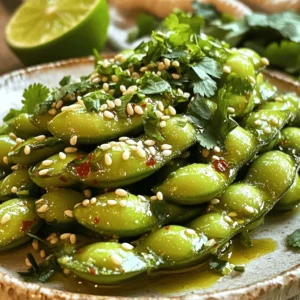 - 2 cups edamame in pods (fresh or frozen) - 3 tablespoons olive oil - 4 cloves garlic, finely minced - 1 teaspoon red chili flakes - 1 tablespoon soy sauce - 1 tablespoon sesame oil - 1 teaspoon freshly squeezed lime juice - Sea salt, to taste - Sesame seeds and fresh cilantro for garnish In this recipe, we start with the main ingredients. The edamame pods are packed with protein and fiber. You can use fresh or frozen edamame. Fresh edamame offers great flavor, while frozen is quick and easy. Next, don't skimp on the olive oil. It gives a rich flavor to the dish. The garlic adds depth and a lovely aroma. For flavor enhancers, red chili flakes bring the heat. Adjust the amount based on your spice level. Soy sauce adds umami and saltiness. Sesame oil gives a nutty taste that rounds out the dish perfectly. Lastly, finishing touches include lime juice, which adds a bright zing. Sea salt enhances all the flavors. I love to garnish with sesame seeds and fresh cilantro. They add color and freshness to the dish. For the full recipe, check out the steps in the next section! To start, you need to choose between fresh or frozen edamame. Fresh edamame has a bright green color and a tender bite. Frozen edamame is quick and easy. If you pick frozen, follow the package instructions. They usually take about 5 minutes in boiling water. For fresh edamame, fill a pot with water. Add a pinch of salt and bring it to a boil. Carefully add the edamame pods to the pot. Cook them for 3-5 minutes until they are bright green and tender. Drain them well and set them aside. To check for doneness, look for vibrant color. The pods should feel soft when squeezed slightly. If they are still hard, give them a little more time in the water. Next, heat the olive oil in a large skillet over medium heat. Make sure the oil is hot, but not smoking. This step is crucial for great flavor. Add the minced garlic to the skillet. Sauté it for 1-2 minutes, stirring often. The garlic should turn fragrant and light golden. Keep a close eye on it. Burnt garlic can ruin your dish and make it bitter. After the garlic is ready, stir in the red chili flakes. This step releases their spicy aroma. Let them cook for about 30 seconds. Now it's time to combine everything. Carefully add the cooked edamame to the skillet. Toss them gently in the garlic and chili oil. Make sure each pod is well-coated. Add the soy sauce and sesame oil. Toss the edamame for another 2-3 minutes. This helps all the flavors blend nicely. Finish by squeezing fresh lime juice over the mixture. Season with sea salt to taste. Give everything one last mix to ensure all the flavors are combined. To serve, transfer the spicy edamame to a bowl. Top with sesame seeds and chopped cilantro for a pop of color. Serve warm for the best taste. You can even place the bowl on a colorful plate to make it look more inviting. For fun, add toothpicks for easy eating and some lime wedges on the side for extra zest. Enjoy your snack! For the full recipe, check out the detailed instructions above. To make the best spicy garlic edamame, adjust the spice levels with chili flakes. Start with one teaspoon. Taste, then add more if you want it hotter. Remember, you can always add more, but you can't take it out! For fresh garlic, use whole cloves. Mince them finely to release their flavor. This step is key. Sauté the garlic until it turns golden, but don’t let it burn. Burnt garlic tastes bitter and ruins your dish. You can cook edamame in several ways. Steaming is a great option that keeps them tender. Just put them in a steamer basket over boiling water for five minutes. If you're short on time, microwaving works too. Place them in a bowl with a splash of water and cover. Cook for three to four minutes. To achieve the best texture, make sure you don’t overcook them. Edamame should be bright green and firm. If they are mushy, they lose their crunch. That crunch is part of the fun! For parties, serve the spicy garlic edamame in a colorful bowl. A vibrant plate catches the eye. You can even use a wooden board for a rustic touch. Garnish with sesame seeds and fresh cilantro. This not only adds flavor but also makes your dish look pretty. A few lime wedges on the side add a pop of color and a zesty kick. Your guests will love it! {{image_4}} You can change the flavor of Spicy Garlic Edamame easily. Try different oils like avocado or peanut oil. Each oil brings a unique taste. You can also mix in sauces. For instance, try adding chili oil for more heat or teriyaki sauce for sweetness. Experiment with herbs too. Fresh basil or cilantro can brighten the dish. Spicy Garlic Edamame is versatile. You can use it as a salad topping. Simply chop up some greens and add the edamame on top. It adds a nice crunch and flavor. You can also use it as a filling for wraps or rice bowls. Just place edamame inside your wrap with veggies and protein. It adds a tasty twist to your meal. If you need a gluten-free option, use tamari in place of soy sauce. It tastes great and fits your needs. For vegan-friendly substitutions, make sure all sauces are plant-based. You can also switch out the sesame oil for any other oil you prefer. This way, you can enjoy this snack no matter your dietary needs. For the full recipe, check out the cooking details provided earlier. Happy snacking! To keep your Spicy Garlic Edamame fresh, store it in an airtight container. Place it in the fridge within two hours of cooking. This helps prevent any bacteria growth. Leftovers can stay good for up to three days. When you are ready to eat them, just reheat in a skillet. Heat on medium for about three to five minutes. This way, you keep the flavors intact. If you want to freeze your edamame, first let it cool completely. Then, place it in a freezer-safe bag. Remove as much air as possible to avoid freezer burn. Cooked edamame can last for up to three months in the freezer. When you want to use it, take it out and thaw in the fridge overnight. For quick thawing, you can run warm water over the bag. This keeps the flavor and texture fresh for your next snack time! You can cook edamame in three main ways: boiling, steaming, or microwaving. - Boiling: Fill a pot with water and add salt. Bring it to a boil. Add edamame pods and cook for 3-5 minutes. They should turn bright green and feel tender. - Steaming: Place edamame in a steamer basket over boiling water. Cover and steam for about 5-7 minutes. This method keeps them vibrant and firm. - Microwaving: Place edamame in a microwave-safe bowl. Add a splash of water and cover. Microwave on high for about 4-5 minutes. Check for doneness and add more time if needed. Each method works well, but boiling often gives the edamame a softer texture. Yes, you can use frozen edamame without thawing. Just cook them according to the package instructions. Usually, they need about 4-6 minutes in boiling water. Drain them after cooking, and they are ready for your recipe. This makes it quick and easy to enjoy your Spicy Garlic Edamame. To reduce the spice in Spicy Garlic Edamame, you have a few options. - Reduce chili flakes: Use less than the recipe calls for, starting with half a teaspoon. - Add sugar: A pinch of sugar can help balance the heat. - Incorporate more oil: Adding extra olive oil helps dilute the spice. - Serve with yogurt: Offering a side of plain yogurt can cool down the heat. These tips let you enjoy the dish without overwhelming your taste buds. Yes, Spicy Garlic Edamame is a healthy snack option! Edamame is rich in protein, fiber, and vitamins. Here are some benefits: - Protein source: Edamame is a complete protein, containing all essential amino acids. - High in fiber: This helps with digestion and keeps you full longer. - Low in calories: A serving has fewer calories than many other snacks. - Rich in antioxidants: These help fight free radicals in your body. Enjoying this dish gives you a tasty treat that supports a healthy lifestyle. Spicy Garlic Edamame combines simple ingredients for bold flavors. We covered the main ingredients, from edamame to spices. You learned how to prepare, sauté, and serve this tasty dish. Plus, tips for flavor and presentation will elevate your cooking game. Incorporate variations for unique flavors, and store leftovers properly. Whether you enjoy it as a snack or a meal, this recipe is fun and flexible. Dive into this delight, and impress your friends! Your cooking will shine.