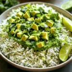 To make Avocado Cilantro Lime Rice, gather these simple ingredients: - 1 cup white rice (jasmine or basmati) - 2 cups vegetable broth (or water) - 1 ripe avocado, cut into bite-sized pieces - 1/4 cup fresh cilantro, finely chopped - 2 tablespoons lime juice (freshly squeezed) - 1 tablespoon extra virgin olive oil - 1/2 teaspoon garlic powder - Salt and freshly cracked pepper to taste - Zest of 1 lime Each ingredient plays a key role. The rice provides a fluffy base. The broth adds depth and flavor. Fresh avocado brings creaminess. Cilantro adds bright notes. Lime juice adds zing, while the garlic powder gives a hint of warmth. Using fresh ingredients makes a big difference. Fresh cilantro and lime juice enhance the dish's flavor. The avocado needs to be ripe for the best texture. I always recommend checking for ripeness by gently pressing the avocado; it should yield slightly. For the best results, use high-quality extra virgin olive oil. This will give your dish a lovely richness. The combination of flavors makes this rice a standout side or a base for your meals. Check out the Full Recipe for more details! To rinse rice, place it in a fine-mesh strainer. Run cold water over it. Move the rice around with your fingers. Keep rinsing until the water runs clear. Rinsing removes extra starch. This step is key for light, fluffy rice. First, combine the rinsed rice with vegetable broth in a medium pot. Bring the mixture to a boil over medium-high heat. Once it boils, turn the heat to low. Cover the pot with a lid. Let it simmer for 15 to 18 minutes. The rice will absorb the liquid and become tender. After cooking, let it sit covered for 5 more minutes. This helps the rice finish cooking. While the rice cooks, make the dressing. In a small bowl, whisk together olive oil, lime juice, garlic powder, salt, and pepper. Mix until smooth. Homemade dressing boosts flavor. It makes every bite taste fresh and zesty. After resting, fluff the rice gently with a fork. Transfer the rice to a large bowl. Drizzle the dressing on top. Toss the rice lightly to coat it evenly. Next, fold in the avocado, cilantro, and lime zest. Be gentle to keep the avocado pieces whole. This adds texture and freshness. Taste the rice mixture. Adjust the seasoning to your liking. Add more salt or lime juice if needed. A little tweak can enhance the flavor. Enjoy your flavorful and fresh dish of Avocado Cilantro Lime Rice! If you want the full recipe, check the section above. Cooking rice can be simple if you follow a few key steps. The best method for cooking rice is to rinse it first. Rinse under cold water until it runs clear. This step removes excess starch. It helps keep your rice fluffy and not sticky. Next, use a ratio of two cups of broth for every cup of rice. This gives great flavor. Bring the mixture to a boil, then reduce the heat to low. Cover the pot and let it simmer. This keeps the rice tender. Common mistakes include lifting the lid too often or not letting it rest. Keep the lid on while it cooks. After cooking, let the rice sit for five minutes. This allows it to finish steaming. For serving, choose a large bowl to showcase your Avocado Cilantro Lime Rice. Garnish with extra lime wedges and fresh cilantro leaves. This adds color and freshness. Pair this rice with grilled chicken or shrimp. Tacos or beans also work well. The bright flavors complement many dishes. This dish is not just tasty; it's also good for you. One serving contains about 250 calories. It provides good fats from avocado and vitamins from cilantro. Avocados are rich in healthy fats. They support heart health and provide fiber. Cilantro adds antioxidants and can help with digestion. This dish is a smart choice for a balanced meal. For the full recipe, click here: [Full Recipe]. {{image_4}} You can easily change the taste of avocado cilantro lime rice. Adding spices gives it more flair. Try a pinch of cumin or chili powder for warmth. Fresh herbs like mint or parsley can also brighten the dish. You can mix in vegetables for extra nutrition. Diced bell peppers or corn add color and crunch. You can even stir in some black beans for protein. These tweaks keep the dish exciting and flavorful. Making this recipe vegan is simple. Just use vegetable broth instead of chicken broth. You can also swap out the olive oil for avocado oil if you prefer. This dish is naturally gluten-free, so you don't need to worry there. If you have nut allergies, ensure any added toppings are safe. You can easily tailor this dish to fit various diets. Just think about what works best for you and your guests. You can serve avocado cilantro lime rice in many ways. It works well as a base for grain bowls, topped with grilled chicken or shrimp. You can serve it as a side dish with tacos or enchiladas. The rice also makes a great filling for wraps. If you have leftovers, use them in a stir-fry or salad. The fresh flavors will shine through, keeping meals fun and tasty. To keep your Avocado Cilantro Lime Rice fresh, store it in an airtight container. This method prevents moisture loss and keeps flavors intact. Place it in the fridge as soon as possible. Rice often stays good for about three to four days. If you want to keep the avocado from browning, sprinkle a bit of lime juice on it before storing. This trick helps maintain the bright color and fresh taste. Yes, you can freeze Avocado Cilantro Lime Rice! Freezing is a great way to save leftovers. First, let the rice cool down completely. Then, place it in a freezer-safe bag or container. Press out as much air as possible before sealing. It can last up to three months in the freezer. To reheat, simply take it out and let it thaw in the fridge overnight. You can also microwave it directly from the freezer. Just add a splash of water to keep it moist. Heat until warm, stirring occasionally. Enjoy your delicious rice even after freezing! For the full recipe, check out the Zesty Avocado Cilantro Lime Rice. You can make this rice dish ahead of time. Cook the rice and let it cool. Store it in a sealed container in the fridge for up to three days. When you are ready to serve, mix in the fresh ingredients like avocado and cilantro. This keeps the flavors bright and fresh. If you don’t have avocado, you can use cooked peas or diced mango. Both add creaminess and sweetness. The taste will change a bit, but it will still be tasty. Yes, this recipe works well for meal prep. You can batch cook the rice and keep it in the fridge. Portion out servings for lunches or dinners. Just add the fresh ingredients right before eating to keep them crisp. You can use brown rice, but it needs a little more time to cook. Use 2 and a half cups of broth and simmer for about 35 to 40 minutes. Brown rice has a nuttier flavor and adds more fiber. This rice goes well with grilled chicken, fish tacos, or black bean bowls. It also works as a side for any Mexican dish. The zesty flavor brightens up the entire meal. For more ideas, check the Full Recipe for inspiration. This article explored how to make Avocado Cilantro Lime Rice. We covered essential ingredients and detailed steps for perfect rice. You learned about cooking tips, fun variations, and how to store leftovers. Remember, making this dish is simple and enjoyable. It’s not just tasty; it’s also healthy. Try different flavors or incorporate more veggies for a unique twist. Enjoy your cooking and share this dish with others. Your kitchen adventures can be a delight for everyone!