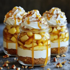 - 2 cups cream cheese, softened to room temperature - 1 cup powdered sugar - 1 teaspoon vanilla extract - 1 cup heavy cream - 2 large apples, peeled, cored, and diced into small pieces - 1 tablespoon fresh lemon juice - 1 teaspoon ground cinnamon - 1 cup graham cracker crumbs - 1 cup caramel sauce (store-bought or homemade) - Whipped cream (for topping) - Chopped nuts (optional, for garnish) To make these delicious parfaits, start with the main ingredients. The cream cheese gives the dessert its rich, creamy base. Powdered sugar sweetens the mix, while vanilla adds flavor. Heavy cream brings a lightness to the dish. Use fresh apples for the best taste. Dicing them small helps them blend well in each layer. Lemon juice keeps the apples bright and fresh. Ground cinnamon adds warmth and spice to the apples. Graham cracker crumbs create a crunchy layer at the bottom. Caramel sauce makes everything sweeter and adds a lovely drizzle on top. Finish with whipped cream for a fluffy touch. If you want a bit of crunch, consider adding chopped nuts. - Extra apple slices - Mint leaves - Additional caramel sauce - More chopped nuts These garnishes add a nice touch to the parfaits. Slices of apple can give a fresh look. Mint leaves add color and a pop of flavor. Drizzling more caramel sauce on top makes it even sweeter. Chopped nuts offer extra crunch and taste. - Mixing bowls - Electric mixer or whisk - Skillet - Parfait glasses or jars - Spatula You’ll need a few simple tools. Mixing bowls help combine ingredients smoothly. An electric mixer or whisk is great for beating the cream cheese and whipping the cream. A skillet is used for sautéing the apples. Finally, parfait glasses or jars are perfect for layering your creation. A spatula helps gently fold ingredients and serve them neatly. Start with your cream cheese. It needs to be soft for the best mix. Place it in a large bowl and use an electric mixer. Beat it until it is smooth. Now, add the powdered sugar slowly. Mix in one teaspoon of vanilla extract. Continue to beat until the mixture is creamy and free of lumps. This step is key for a rich flavor. Next, grab a medium bowl for the heavy cream. Pour it in and prepare to whip. Use a hand mixer or a whisk. Whip the cream until it forms soft peaks. Be gentle here; you want to keep it light and airy. Once whipped, take a spatula and carefully fold it into the cream cheese mix. This adds fluffiness to your parfait. Now, it’s time for the apples. First, peel, core, and dice them into small pieces. Heat a skillet over medium heat. Add the diced apples along with one tablespoon of fresh lemon juice. Stir them often for about five minutes. They should be tender but not mushy. After that, sprinkle one teaspoon of ground cinnamon over the apples. Stir well for one more minute, then remove from heat. Let them cool slightly before using. Start with your parfait glasses or jars. Add a spoonful of graham cracker crumbs at the bottom. This will give your parfaits a nice, crunchy base. Next, scoop in a layer of the creamy cheesecake filling. Use a spatula for an even spread. After that, add a layer of the sautéed apples. Make sure to include some of the delicious cinnamon flavor. Drizzle a spoonful of caramel sauce over the apples. This adds sweetness and richness to each bite. Repeat these layers until your glasses are full. Make sure to end with a layer of the cream cheese mixture on top. This will create a beautiful finish. Once your parfaits are layered, it’s time to add the finishing touches. Top each parfait with a generous dollop of whipped cream. This adds a fluffy texture and lightness. Then, drizzle more caramel sauce on top. This will make them look extra tempting. If you want some crunch, sprinkle chopped nuts on top. They add a nice contrast to the creamy layers. You can also garnish with extra apple slices or a sprig of mint for a fresh touch. This makes your parfaits look stunning and inviting. When serving your Caramel Apple Cheesecake Parfaits, use cute plates or trays. This makes the display more appealing. You can serve them chilled or at room temperature. These parfaits make a great dessert for any gathering. They are easy to grab and enjoy. If you have extra caramel sauce, offer it on the side. This way, guests can add more if they wish. These parfaits will impress everyone, and they are so easy to make! {{image_4}} Making your own caramel sauce is easy and fun. Start by heating sugar in a pot over low heat. Stir gently as the sugar melts. Once it turns a golden brown, add butter and cream. Stir until smooth. Let it cool before using it in your parfaits. Homemade caramel tastes rich and adds a special touch. To get the best texture for your parfaits, focus on your cream cheese mixture. Make sure the cream cheese is soft. This helps it mix well with the sugar and vanilla. When you whip the heavy cream, stop just as soft peaks form. Folding the whipped cream gently into the cream cheese keeps it light and fluffy. This texture makes every bite creamy and delightful. Avoid these common mistakes to make perfect parfaits. First, don’t skip softening the cream cheese. Cold cream cheese will not blend smoothly. Second, be careful not to over-whip the heavy cream. Over-whipping can make it grainy instead of fluffy. Lastly, don’t rush the layering process. Take your time to create distinct layers. This makes your parfaits look stunning and taste great. You can easily make gluten-free Caramel Apple Cheesecake Parfaits. Substitute graham cracker crumbs with gluten-free cookies or almond flour. Both options give a nice crunch. Use gluten-free caramel sauce to keep it safe for everyone. Want to mix things up? Try different flavors! Use pears instead of apples for a fresh twist. You can also add some cocoa powder to the cream cheese mixture for a chocolate touch. Or, swap vanilla extract with almond extract for a nutty flavor. The options are endless! To make a lighter version, use low-fat cream cheese instead of regular. You can replace heavy cream with Greek yogurt for a creamy texture without the extra fat. For sweetness, consider using honey or maple syrup instead of powdered sugar. These swaps keep the taste great while adding some health benefits. Yes, you can prepare these parfaits a day in advance. Make the cream cheese mixture and sauté the apples ahead of time. Store them in separate containers in the fridge. Assemble the parfaits just before serving. This keeps the layers fresh and tasty. The best apples for this recipe are Granny Smith or Honeycrisp. Granny Smith apples add a nice tartness that balances the sweet caramel and creamy cheesecake. Honeycrisp apples are sweet and crunchy, adding great texture. You can mix both types for extra flavor. These parfaits last about three days in the fridge. Store them covered to keep them fresh. If you notice any browning on the apples, simply stir them back in. However, the whipped cream may lose its fluffy texture over time. Making Caramel Apple Cheesecake Parfaits is simple and fun. You learned what ingredients to use, how to prepare the mixture, and the best ways to layer your parfaits. I shared tips for making homemade caramel and common mistakes to avoid. You can also try gluten-free options or different flavors to personalize your dessert. In the end, these parfaits are a treat everyone will love. Enjoy the process and share them with family or friends. Your parfaits will impress!