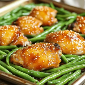 - 4 boneless, skinless chicken thighs - 2 cups fresh green beans, trimmed - 1/4 cup honey - 3 tablespoons soy sauce - 3 cloves garlic, finely minced - 1 tablespoon extra virgin olive oil - 1 teaspoon ground ginger - 1/2 teaspoon freshly cracked black pepper - Sea salt to taste - 1 teaspoon sesame seeds - Fresh herbs like cilantro or parsley Gathering the right ingredients is key to making this dish shine. Chicken thighs bring juicy flavor, while fresh green beans add a nice crunch. Honey and soy sauce together create a sweet and savory sauce that makes every bite special. For the marinade, garlic and ground ginger pack a punch. They give the chicken a deep taste. Olive oil helps the marinade stick to the chicken and adds richness. Black pepper adds a hint of spice, and sea salt brings out all the flavors. I like to finish the dish with sesame seeds and fresh herbs. These optional garnishes not only add texture but also brighten up the plate. You can use cilantro or parsley, depending on your taste. With these ingredients ready, you will set the stage for a meal that is both simple and delightful. 1. First, preheat your oven to 400°F (200°C). This step is key for even cooking. 2. Next, line a large baking sheet with parchment paper. This makes cleanup easy later on. 3. In a mixing bowl, whisk together the following: - 1/4 cup honey - 3 tablespoons soy sauce - 3 cloves garlic, finely minced - 1 tablespoon extra virgin olive oil - 1 teaspoon ground ginger - 1/2 teaspoon freshly cracked black pepper This mixture is your marinade. It will add great flavor to the chicken and green beans. - To marinate chicken thighs properly, use a large resealable plastic bag or a shallow dish. Place the chicken thighs inside. - Pour half of the marinade over the chicken. Make sure each piece is well coated. Seal the bag or cover the dish. - For best flavor, let the chicken marinate in the fridge for at least 30 minutes. If you have more time, two hours is even better. - After marinating, take the chicken from the fridge. Discard any leftover marinade used for the chicken. - Arrange the marinated chicken thighs on the prepared baking sheet. - Use the same bowl with the marinade. Add the trimmed green beans, tossing them to coat well. - Spread the green beans around the chicken on the baking sheet. - Bake everything in your preheated oven for 25 to 30 minutes. Check that the chicken reaches an internal temperature of 165°F (75°C) and is no longer pink in the center. The green beans should stay tender but still have a nice crunch. - Once done, take the baking sheet from the oven. Let the chicken and green beans rest for about 5 minutes. This helps the juices redistribute. - Before serving, sprinkle sesame seeds over the chicken and green beans for added crunch and a nice look. To boost your marinade, try adding a splash of rice vinegar. It adds a tangy kick. You can also mix in some red pepper flakes for heat. Marination time is key. Letting your chicken sit in the marinade for at least 30 minutes helps it soak up those yummy flavors. For the best taste, aim for two hours. This allows the honey and garlic to really shine. To check if your chicken is done, use a meat thermometer. The safe internal temperature is 165°F (75°C). If you don’t have a thermometer, cut into the thickest part. The meat should be white, with no pink inside. For crispy green beans, make sure they are spread out on the sheet pan. If they are crowded, they will steam instead of roast. A little space helps them get nice and crunchy. For a fun twist, serve the dish right on the baking sheet. It looks rustic and inviting. If you want to plate it, add fresh herbs like cilantro or parsley on top. They make the dish pop! Pair your meal with fluffy rice or crispy bread to soak up the sauce. A light salad on the side adds freshness and color to your plate. {{image_4}} You can make this dish healthier by swapping chicken thighs for chicken breasts. Chicken breasts have less fat and still taste great. Try using different vegetables too. Bell peppers and broccoli work well and add color. To boost the taste, add spices or herbs to the marinade. Try using paprika for a smoky flavor or fresh basil for a touch of brightness. You can also incorporate different sauces. Teriyaki sauce or hoisin sauce can give you a new twist on the original recipe. This recipe shines as a sheet pan dinner, but you can switch it up. You may choose stovetop preparation for a quicker meal. If you want a complete dish, make it a one-pot meal with rice or quinoa. Both options soak up the flavors and make it more filling. After enjoying your honey garlic chicken and green beans, store leftovers in the fridge. Use an airtight container to keep the flavors fresh. This dish stays good for up to three days. Make sure to cool it to room temperature before sealing it up. To freeze, pack the chicken and green beans in freezer-safe containers. Leave some space at the top, as the food expands when frozen. You can freeze it for up to three months. When you're ready to eat, defrost it overnight in the fridge. For reheating, bake it at 350°F (175°C) until heated through. When reheating, use the oven or a skillet. This keeps the chicken juicy. For the green beans, add a splash of water in the pan and cover it. This helps them stay crisp. Avoid the microwave, as it can make the beans soggy. Enjoy your meal! Yes, you can use frozen green beans. They will need a bit more time to cook. Frozen beans may also be softer than fresh ones. I suggest cooking them for about 5 extra minutes. This helps them get tender but not mushy. Keep an eye on them to avoid overcooking. If you need a honey substitute, try maple syrup or agave nectar. Both offer sweetness but change the flavor slightly. Maple syrup gives a richer taste, while agave is milder. Use the same amount as honey. You can also try brown sugar, but dissolve it first in a bit of water. To make this dish gluten-free, use gluten-free soy sauce. Many brands offer this option. You can also use coconut aminos as a tasty alternative. Make sure to check labels for hidden gluten in sauces. Keeping the chicken and green beans fresh will help maintain the great flavor. This recipe for marinated chicken thighs with green beans is simple and delicious. You learned about choosing the right ingredients and marinating them to maximize flavor. I shared tips for cooking and serving options that will impress anyone. Don't forget, you can switch up the ingredients for a healthier meal or different flavors. Enjoy storing and reheating leftovers for easy meals later. Remember, cooking should be fun and creative!
