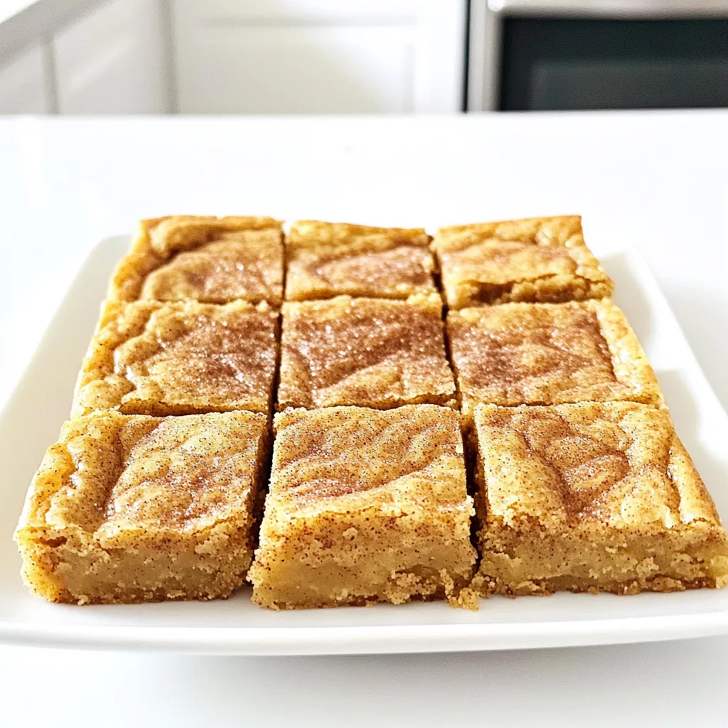 - 1 cup unsalted butter - 1 cup packed light brown sugar - 1/2 cup granulated sugar - 2 large eggs - 2 teaspoons vanilla extract - 2 cups all-purpose flour - 1 teaspoon baking powder - 1/2 teaspoon baking soda - 1/4 teaspoon salt To create the perfect base for your blondies, you need key ingredients. The unsalted butter is essential for that rich flavor. You will melt this butter until it turns golden brown. This process brings out its nutty taste. Next, you need both brown sugar and granulated sugar. Brown sugar adds moisture and depth. Granulated sugar gives the blondies a lovely sweetness. Eggs and vanilla extract are vital too. They bind the mix and infuse a sweet aroma. Finally, the dry mix includes all-purpose flour, baking powder, baking soda, and salt. The flour gives structure. Baking powder and baking soda help it rise. A little salt enhances the sweet flavors. - 2 tablespoons ground cinnamon - 1/4 cup granulated sugar (for topping) The topping is where the magic happens. Ground cinnamon brings warmth and spice. Mixing it with granulated sugar creates a sweet, crunchy crust. This blend gets sprinkled on top before baking. It makes your blondies smell amazing while they cook. Enjoy this delightful topping for a perfect finish to your treats! Preheat your oven to 350°F (175°C). This temperature gives the blondies a nice, even bake. While the oven heats, prepare your 9x13 inch baking dish. You can grease it lightly with butter or oil. Alternatively, line it with parchment paper. This helps with easy removal later. In a medium saucepan, melt 1 cup of unsalted butter over medium heat. Stir it often for about 5-7 minutes. Watch closely as the butter changes color. You want it to turn a rich golden brown. This browning gives the blondies a nutty flavor. Once it reaches the right shade, remove it from heat and let it cool slightly. In a large mixing bowl, combine the browned butter with 1 cup of packed light brown sugar and 1/2 cup of granulated sugar. Use a whisk to mix them until smooth. Next, add in 2 large eggs, one at a time. Whisk well after each egg to blend it in. Then, stir in 2 teaspoons of vanilla extract until mixed. In another bowl, whisk together 2 cups of all-purpose flour, 1 teaspoon of baking powder, 1/2 teaspoon of baking soda, and 1/4 teaspoon of salt. Add 1 tablespoon of ground cinnamon. Break up any lumps to keep it even. Gradually add this dry mixture to the wet ingredients. Stir gently just until combined. Don't overmix, as this can change the texture. Pour the batter into the prepared baking dish. Use a spatula to spread it evenly into the corners. In a small bowl, mix 1 tablespoon of ground cinnamon with 1/4 cup of granulated sugar. Sprinkle this mixture over the top of the blondie batter. This creates a sweet crust. Bake the blondies in the preheated oven for 20-25 minutes. They are done when a toothpick inserted in the center comes out clean or with a few moist crumbs. Once baked, remove the dish from the oven. Let it cool in the pan for about 10 minutes. After that, transfer the blondies to a wire rack to cool completely. Once cooled, cut them into squares and enjoy! To make perfect blondies, focus on the right texture. You want them soft and chewy. To achieve this, mix just enough to combine the ingredients. Avoid overmixing, as it can lead to a tough texture. Stir gently until no dry flour remains. This helps keep your blondies soft and moist. Browning butter is key to deep flavor. To do it right, melt your unsalted butter in a medium saucepan over medium heat. Watch it closely as it turns golden brown. Keep stirring to prevent burning. The signs of perfectly browned butter are a nutty aroma and a rich amber color. You’ll know it’s ready when it smells amazing and looks beautiful. When serving your blondies, a decorative plate adds charm. Cut them into squares for easy sharing. For an added touch, dust the tops with powdered sugar. You can also drizzle caramel sauce for extra sweetness. This simple presentation makes your treats look stunning and inviting. {{image_4}} You can make your Brown Butter Snickerdoodle Blondies even more fun. Adding nuts, chocolate chips, or dried fruits gives them a twist. Here are some popular choices: - Chopped Walnuts or Pecans: These add a nice crunch. - Chocolate Chips: Try milk or dark chocolate for a sweeter treat. - Dried Fruits: Raisins or cranberries add a fruity burst. Each choice brings new flavors. Feel free to mix and match to find your favorite! You can play with flavors to make the blondies unique. A few ideas include: - Almond Extract: Use this instead of vanilla for a nutty twist. - Cinnamon Variations: Try different spices like nutmeg or cardamom. - Cocoa Powder: Swapping out some flour for cocoa gives a chocolatey flavor. These flavor changes can spice up the recipe. Experiment and find what makes your taste buds happy! For those with food restrictions, you can adapt this recipe. Here are some options: - Gluten-Free: Use a gluten-free flour blend in place of all-purpose flour. - Dairy-Free: Substitute the butter with coconut oil or a dairy-free butter. These changes keep the blondies delicious while catering to different diets. Enjoy making treats everyone can savor! To keep your Brown Butter Snickerdoodle Blondies fresh, store them in an airtight container. This helps prevent them from drying out. Place a piece of parchment paper between layers to avoid sticking. Keep them at room temperature for the best texture and taste. If you want to save some blondies for later, freezing is a great option. Cut the blondies into squares. Wrap each square tightly in plastic wrap. Then, place them in a freezer bag or container. Be sure to label the bag with the date. They will stay fresh for up to three months in the freezer. At room temperature, these blondies can last about 3 to 5 days. If you store them in the fridge, they can last up to a week. However, the texture might change slightly when chilled. For the best taste and texture, enjoy them fresh! Store your blondies in an airtight container. Keep them at room temperature for up to four days. If you want to keep them longer, place them in the fridge for up to a week. For the best flavor, let them sit at room temperature for a bit before enjoying. Yes, you can use salted butter. Just cut back on the added salt in the recipe. This helps keep the flavor balanced. However, unsalted butter is best for precise control over taste. The blondies are done when a toothpick comes out clean or with a few moist crumbs. They should look slightly golden on top and feel firm to the touch. Avoid overbaking, as this can make them dry. You can swap the all-purpose flour with a gluten-free blend. You can also use coconut sugar for a different sweetness. If you want a nutty flavor, add chopped nuts or chocolate chips. Just keep the ratios similar for the best results. If your blondies turn out too dry, try adding a bit of butter or milk to the next batch. Make sure to mix just until combined. Also, check your oven temperature with a thermometer to avoid overbaking. This blog discussed how to make delicious Brown Butter Snickerdoodle Blondies. We covered essential ingredients, step-by-step instructions, and helpful tips. You learned about storage, variations, and answers to common questions. Now you can create these treats with confidence. Feel free to experiment and enjoy every bite! Perfect blondies await you with just a bit of effort and care.