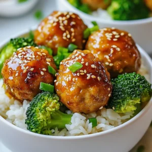 - 1 lb ground chicken - 1/4 cup panko breadcrumbs - 1/4 cup green onion, finely chopped - 1 clove garlic, minced - 1 tablespoon ginger, freshly grated - 2 tablespoons soy sauce - 1 tablespoon sesame oil - 2 tablespoons honey - 1 tablespoon rice vinegar - 1/4 cup teriyaki sauce - 2 cups cooked jasmine rice - 1 cup steamed broccoli florets - Sesame seeds, for garnish - Additional chopped green onions, for garnish These ingredients create a tasty and balanced dish. The ground chicken forms the base. Panko breadcrumbs give the meatballs a light texture. Green onions add a fresh crunch. Garlic and ginger give a lovely aroma and flavor. For the sauce, soy sauce and sesame oil add a savory depth. Honey and rice vinegar balance the flavors well. Teriyaki sauce brings it all together. Serve this over warm jasmine rice. The steamed broccoli adds color and nutrition. Finally, sesame seeds and extra green onions make the dish pop. Each ingredient plays a key role in creating a delicious meal. {{ingredient_image_2}} - Set the temperature to 400°F (200°C). - Prepare a baking sheet with parchment paper to make cleanup easy. - In a large bowl, combine 1 pound of ground chicken with: - 1/4 cup panko breadcrumbs - 1/4 cup finely chopped green onion - 1 clove minced garlic - 1 tablespoon freshly grated ginger - 2 tablespoons soy sauce - 1 tablespoon sesame oil - Mix these ingredients with your hands or a spatula. - Be careful not to overwork the mixture. Overmixing can make the meatballs tough. - Take about 1 inch of the mixture and roll it into smooth balls. - Aim for about 20 meatballs. This size helps them cook evenly. - Arrange the meatballs on the baking sheet. - Bake for 18-20 minutes. They should be golden brown and cooked through. - While the meatballs are baking, make the teriyaki sauce. - In a small saucepan, combine: - 2 tablespoons honey - 1 tablespoon rice vinegar - 1/4 cup teriyaki sauce - Heat over medium-low heat, stirring often. It should thicken in about 3-5 minutes. - Scoop warm cooked jasmine rice into each serving bowl. - Top the rice with baked chicken meatballs and steamed broccoli florets. - Drizzle warm teriyaki sauce over the top. - Add sesame seeds and more chopped green onions for garnish. - Serve right away for a warm and tasty meal. - Moisture is Key: Keeping moisture in your meatball mix makes them tender. Add panko breadcrumbs and green onions for extra juiciness. - Don’t Overmix: Mix just until combined. Overmixing makes meatballs tough. Use your hands or a spatula gently. - Balance the Flavors: Aim for a sweet and salty mix. Honey gives sweetness, while soy sauce adds saltiness. Adjust these to taste. - Custom Sauce Options: You can swap honey for maple syrup or agave. For a kick, add red pepper flakes or sriracha. - Prep Ahead: Chop green onions and garlic before cooking. This makes mixing easy and fast. - Use Leftovers: If you have extra meatballs, serve them in sandwiches or salads the next day. They make a great meal! Pro Tips Use Fresh Ingredients: Fresh garlic and ginger will enhance the flavor of your meatballs significantly. Always opt for freshly grated ginger and minced garlic for the best results. Don’t Overmix: When combining the ingredients for the meatballs, mix until just combined. Overmixing can lead to tough meatballs, so be gentle with your mixing technique. Adjust for Spice: If you prefer a bit of heat, consider adding a pinch of red pepper flakes or a dash of sriracha to the meatball mixture for a spicy kick. Experiment with Toppings: Feel free to customize your bowls with additional toppings like sliced avocado, pickled ginger, or a sprinkle of chopped cilantro for added flavor and texture. {{image_4}} You can change the ground chicken in this recipe. Ground turkey works well too. It has a mild taste and cooks the same way. For a beef option, use ground beef. It adds a rich flavor. For plant-based choices, try lentils or chickpeas. Both give a tasty twist while keeping it healthy. While teriyaki sauce is great, you can mix it up. Try a sweet chili sauce for a spicy kick. If you prefer less sweetness, use soy sauce with garlic. Adding sriracha gives heat, while hoisin sauce adds depth. Adjust each sauce to fit your taste. Serve your meatball bowls with fun sides. Steamed green beans or snap peas add color. You could also try pickled vegetables for a tangy crunch. If you have leftovers, use them in wraps or salads. Simply chop the meatballs and toss them with fresh greens. This way, you can enjoy a new meal with little effort. To keep your teriyaki chicken meatball bowls fresh, follow these steps: - Let the meatballs cool down. - Place them in an airtight container. - Store in the fridge for up to three days. - For longer storage, freeze the meatballs. Use a freezer-safe bag or container. Freezing them helps keep their flavor and texture. Just make sure to label the container with the date. To reheat your meatballs and rice, use these methods: - Microwave: Place meatballs on a microwave-safe plate. Heat for about 1-2 minutes. Stir halfway through for even heating. - Oven: Preheat your oven to 350°F (175°C). Place meatballs in a dish, cover with foil, and heat for about 10-15 minutes. These methods help keep the meatballs juicy and tasty. Your teriyaki chicken meatball bowls last: - In the fridge: 3 days. - In the freezer: up to 3 months. Always check for any signs of spoilage before eating. Enjoy your meal! Yes, you can make the meatballs ahead. Prepare them and store them in the fridge for up to two days. You can also freeze them. Place the meatballs on a baking sheet and freeze until solid. Then, transfer them to a freezer-safe bag. They can last up to three months in the freezer. When you are ready to eat, just bake or heat them up. This makes meal prep easy! You have many tasty options! Here are some sides that pair well: - Steamed bok choy - Sautéed snap peas - Cucumber salad - Edamame - Pickled vegetables These sides add color and flavor to your meal. They also balance the sweetness of the teriyaki sauce. You can easily make this dish gluten-free! For soy sauce, use tamari. It has the same great taste without gluten. For breadcrumbs, swap panko with gluten-free breadcrumbs. Both changes keep the flavor while making it safe for gluten-sensitive eaters. You can choose either method! Baking is easier and healthier. It gives you nicely browned meatballs with less mess. Frying adds a crispy texture and rich flavor. If you fry, use a bit of oil and cook them in batches. Both methods work well; it just depends on your preference! In this post, we explored how to make delicious Teriyaki Chicken Meatballs. You learned about the main ingredients, step-by-step instructions, and tips for perfecting your meatballs. I shared variations for proteins and sauces, plus storage info to keep leftovers fresh. Cooking these meatballs is easy and fun. Whether for a weeknight dinner or meal prep, they work well everywhere. Enjoy your cooking and impress your friends with this tasty dish!