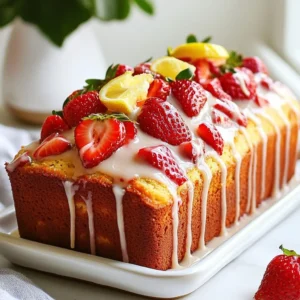 - 1 cup plain Greek yogurt - 1 cup granulated sugar - 3 large eggs - Zest of 1 lemon - 1/4 cup freshly squeezed lemon juice - 1/2 cup vegetable oil - 1 teaspoon vanilla extract - 2 cups all-purpose flour - 2 teaspoons baking powder - 1/2 teaspoon baking soda - 1/4 teaspoon salt - 1 cup fresh strawberries, hulled and diced To create this lovely loaf, the star is plain Greek yogurt. It gives the loaf a rich taste and keeps it moist. The sugar adds sweetness, while the eggs help bind everything together. Lemon zest and juice bring a bright flavor. The oil keeps the loaf tender, and vanilla adds warmth. - Additional fresh strawberries for garnish You can elevate your loaf by adding fresh strawberries on top. They make your loaf look bright and inviting. Plus, they add a burst of flavor. - 9x5 inch loaf pan - Mixing bowls (one large, one medium) - Whisk or electric mixer - Spatula or wooden spoon - Measuring cups and spoons - Parchment paper (optional) - Wire rack for cooling Having the right tools makes baking easier. A loaf pan helps shape your cake. Mixing bowls let you combine ingredients well. A whisk or mixer helps you blend everything smoothly. A spatula ensures you mix well without overworking the batter. Parchment paper aids in easy removal, and a wire rack cools the loaf evenly. {{ingredient_image_2}} Start by preheating your oven to 350°F (175°C). Take a 9x5 inch loaf pan and grease it lightly with baking spray. You can also line it with parchment paper. This step helps the loaf come out easily after baking. In a large mixing bowl, add 1 cup of plain Greek yogurt and 1 cup of granulated sugar. Use a whisk or an electric mixer to blend these until creamy and smooth. Make sure there are no lumps. Next, add 3 large eggs, the zest of 1 lemon, and 1/4 cup of freshly squeezed lemon juice. Then, pour in 1/2 cup of vegetable oil and 1 teaspoon of vanilla extract. Whisk everything well until it looks uniform and mixed nicely. In a separate bowl, whisk together 2 cups of all-purpose flour, 2 teaspoons of baking powder, 1/2 teaspoon of baking soda, and 1/4 teaspoon of salt. This step ensures even distribution of the leavening agents. Gradually add the dry mix to the wet mixture in three parts. Stir gently with a spatula or wooden spoon until just combined. Be careful not to over-mix. Now, fold in 1 cup of diced fresh strawberries gently, ensuring they spread throughout the batter. Pour the batter into your prepared loaf pan. Smooth the top with a spatula for an even bake. Bake in the preheated oven for 50-60 minutes. Check for doneness by inserting a toothpick in the center; it should come out clean. If the top browns too fast, loosely cover it with aluminum foil halfway through. After baking, let the loaf cool in the pan for about 10 minutes. Then, transfer it to a wire rack to cool completely. If you like, slice the loaf and top it with extra fresh strawberries for a bright finish. To keep your loaf moist, use Greek yogurt. This ingredient adds creaminess and moisture. Make sure to measure accurately. Too much flour can make it dry. You can also add a bit more lemon juice for extra moisture. Remember, don’t over-mix the batter; this can toughen the loaf. To ensure even baking, preheat your oven to 350°F (175°C). An oven thermometer can help check the temperature. Place the loaf in the center of the oven for balanced heat. If you notice the top browning too fast, cover it with foil. This prevents burning while the inside cooks fully. To prevent sinking strawberries, toss them in a bit of flour before adding them to the batter. This helps them stay suspended in the mixture. Fold the strawberries in gently to avoid breaking them. This keeps your loaf looking beautiful and full of flavor. Pro Tips Choose Ripe Strawberries: Use fresh, ripe strawberries for the best flavor. Look for berries that are bright red and fragrant for maximum sweetness. Don't Overmix: When combining the wet and dry ingredients, mix just until incorporated. Overmixing can lead to a dense loaf, so be gentle. Cooling Time: Allow the loaf to cool completely before slicing to ensure clean cuts and to prevent the loaf from becoming gummy. Experiment with Flavors: Feel free to add different fruits or spices such as blueberries or a hint of cinnamon to customize the loaf to your taste. {{image_4}} You can change the taste of your loaf by adding different fruits. Raspberries, blueberries, or blackberries work well. Each of these fruits adds its own flavor and color. For a tropical twist, try diced mango or pineapple. When using berries, make sure they are fresh and diced small so they mix in well. Remember to adjust the sugar based on how sweet your fruit is. To make this loaf vegan, you can swap the eggs with flax eggs. Mix 1 tablespoon of ground flaxseed with 2.5 tablespoons of water for each egg. Let it sit for a few minutes until thick. You can use almond milk or coconut yogurt instead of Greek yogurt. For the oil, a plant-based option like coconut oil or applesauce works great. This keeps the loaf moist and delicious while being kind to our furry friends. Adding almond extract gives your loaf a warm flavor. Use about half a teaspoon for a gentle taste. You can also mix in spices like cinnamon or nutmeg. These spices create a cozy aroma as your loaf bakes. Just be careful not to overpower the fresh fruit flavors. A splash of lemon or orange zest can brighten the loaf even more. Experiment with these flavors to find your favorite mix! To keep your leftover loaf fresh, wrap it well. Use plastic wrap or aluminum foil. You can also place it in an airtight container. Store it at room temperature for up to three days. If you want to keep it longer, the fridge is a good option. In the fridge, it will last about a week. Just remember to let it cool completely before wrapping. This helps avoid sogginess. Freezing is a great way to save your loaf for later. First, slice the loaf into individual pieces. Wrap each slice in plastic wrap. Then, place the wrapped slices in a freezer bag. Press out the air before sealing. The loaf can last in the freezer for up to three months. When you're ready to enjoy, just take out a slice and thaw it. You can thaw it overnight in the fridge or leave it out for a few hours. To reheat your slices, the oven works best for a warm texture. Preheat your oven to 350°F (175°C). Place the slices on a baking sheet. Cover them with foil to prevent drying out. Heat for about 10 minutes. You can also use a microwave for a quick option. Just microwave each slice for about 15-20 seconds. This warms it up without making it tough. Enjoy it warm for the best taste! Yes, you can use regular yogurt. However, Greek yogurt adds creaminess and tang. If you use regular yogurt, the loaf may be slightly less moist. You can also try plant-based yogurt for a dairy-free option. Just ensure it has a similar texture to Greek yogurt for the best results. To check if the loaf is ready, insert a toothpick in the center. If it comes out clean, your loaf is done. If you see wet batter on the toothpick, bake it a bit longer. Also, the top should be golden brown and spring back when lightly touched. This loaf pairs well with a few toppings. Fresh whipped cream adds sweetness and richness. You can also serve it with a scoop of vanilla ice cream for a treat. Consider a drizzle of lemon glaze for extra zing. Pairing it with a cup of tea or coffee enhances the flavors too. This blog post covered everything you need for making a Strawberry Lemon Yogurt Loaf. We explored the key ingredients, tools, and step-by-step instructions for baking. I shared tips to keep your loaf moist and variations to try. Plus, I provided storage info and answered some common questions. Now, you can confidently make this tasty loaf at home. Enjoy each slice, and don’t forget to share it with friends and family!