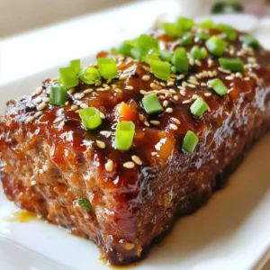 - 1 lb ground beef (or ground turkey for a lighter option) - 1 cup seasoned breadcrumbs - 1/2 cup finely chopped yellow onion - 1/2 cup grated carrot (about one medium carrot) - 2 cloves garlic, minced - 1/4 cup milk - 1 large egg, lightly beaten - 1/4 cup teriyaki sauce (store-bought or homemade) - 1 tablespoon soy sauce - 1 tablespoon ginger paste (or freshly grated ginger) - 1/4 teaspoon freshly ground black pepper - 1/4 teaspoon fine sea salt - Sesame seeds and chopped green onions for garnish You can swap ground beef for ground turkey. This cuts fat and still tastes great. If you don’t have seasoned breadcrumbs, plain ones will work. Just add a little salt and pepper. For a twist, use chopped bell peppers instead of carrots. You can also try coconut milk in place of regular milk for a creamy touch. To make your meatloaf look special, use sesame seeds and chopped green onions. They add flavor and color. You can also drizzle more teriyaki sauce on top. If you want, serve it with steamed rice and fresh veggies. This makes a fun and complete meal! {{ingredient_image_2}} First, preheat your oven to 350°F (175°C). This step warms up the oven for even cooking. Next, take a standard loaf pan and line it with parchment paper. Leave some paper hanging over the edges. This helps with easy removal later. In a large bowl, combine the ground beef, seasoned breadcrumbs, chopped onion, grated carrot, and minced garlic. Use your hands or a spatula to mix these dry ingredients. Make sure they are well blended. This mix forms the base of your meatloaf. In another bowl, whisk together the milk, beaten egg, teriyaki sauce, soy sauce, ginger paste, black pepper, and sea salt. Mix until smooth. This wet mixture adds moisture and flavor to the meatloaf. It’s important to combine everything well for the best taste. Now, pour the wet mixture into the bowl with the meat and veggies. Gently mix everything together. Use your hands or a spatula and be careful not to overmix. Overmixing can make your meatloaf dense, and we want it light and fluffy. Transfer the meat mixture into the prepared loaf pan. Shape it with your hands to fit snugly in the pan. Once shaped, drizzle teriyaki sauce over the top. This glaze will caramelize while baking, adding a lovely flavor. Place the loaf pan in the preheated oven. Bake for 45-50 minutes. The meatloaf is done when it reaches an internal temperature of 160°F (70°C). After baking, remove it from the oven and let it rest for 10 minutes. This resting time lets the juices redistribute, giving you a moist bite. Enjoy your delicious teriyaki glazed meatloaf! To get the perfect texture in your teriyaki glazed meatloaf, avoid overmixing. When you mix the meat with wet ingredients, do it gently. This keeps the meatloaf light and tender. Use your hands or a spatula to combine the ingredients. If you feel it is too dense, add a bit more milk. This small change can make a big difference. For the best glaze, add teriyaki sauce in two steps. First, drizzle some sauce on top before baking. This helps it soak in and adds flavor. After baking, brush more sauce on top. This gives it a shiny, tasty finish. Don't be shy with the sauce; it brings the dish to life. One common mistake is not letting the meatloaf rest. After baking, let it rest for about 10 minutes. This helps the juices stay inside. Another mistake is cutting the meatloaf too soon. If you cut it right away, the juices run out, and it may dry out. Lastly, don’t skip the garnishes. Sesame seeds and green onions add flavor and a nice look. Pro Tips Use Lean Meat: Opt for lean ground beef or turkey to reduce fat content and enhance the healthiness of your meatloaf. Don’t Overmix: When combining the ingredients, mix just until combined to ensure a tender texture in the final loaf. Let It Rest: Allowing the meatloaf to rest after baking helps the juices redistribute, resulting in a moist and flavorful slice. Experiment with Glaze: Feel free to mix different sauces or add spices to the glaze for unique flavor variations each time you make it! {{image_4}} You can swap ground beef for other meats. Ground turkey offers a leaner choice. Ground chicken or pork also works well. Each protein gives a unique taste and texture. Adjust your seasoning to balance the flavor. While teriyaki sauce is tasty, you can try other glazes. A sweet BBQ sauce adds a smoky touch. For a spicy kick, use sriracha mixed with honey. You can also experiment with hoisin sauce for an Asian twist. Each glaze brings out different flavors in the meatloaf. To make a vegetarian meatloaf, use lentils or black beans. Mash them and mix with breadcrumbs and veggies. For a vegan version, skip the egg and milk. Use flaxseed meal mixed with water as a binder. This keeps the loaf together while staying plant-based. Store leftover meatloaf in an airtight container. Place it in the fridge. This keeps it fresh for about three to four days. If you have more meatloaf than you can eat, freezing is a great option too. To reheat, use the oven for best results. Preheat the oven to 350°F (175°C). Place the meatloaf in a baking dish. Cover it with foil to keep it moist. Heat for about 20 minutes or until it warms all the way through. You can also use a microwave if you're short on time. Just slice the meatloaf and heat for 1 to 2 minutes, checking often. For freezing, let the meatloaf cool completely first. Wrap it tightly in plastic wrap. Then place it in a freezer-safe bag. Label it with the date. It can stay frozen for up to three months. When ready to eat, thaw it in the fridge overnight before reheating. This helps keep the flavor and texture intact. Yes, you can use store-bought teriyaki sauce. It saves time and still tastes great. Look for a sauce with good flavor and no added preservatives for the best result. I recommend serving teriyaki glazed meatloaf with steamed rice and sautéed vegetables. You can also add a fresh salad or pickled vegetables for extra crunch and color. These sides balance the rich flavors of the meatloaf. Check the internal temperature with a meat thermometer. The meatloaf should reach 160°F (70°C). You can also cut into it. The meat should no longer be pink, and juices should run clear. Yes, you can prepare the meatloaf ahead of time. Mix the ingredients, shape it, and cover it. Store it in the fridge for up to 24 hours before baking. This way, you can enjoy a quick meal that is still fresh and tasty. This blog post covers how to make teriyaki glazed meatloaf from start to finish. You learned about the key ingredients, step-by-step cooking methods, and essential tips for great texture. We explored variations and how to store leftovers effectively. In closing, making this dish is simple and rewarding. Enjoy trying your own twists to the recipe! You’ll impress everyone at the table. Happy cooking!